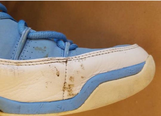 A smudge, possibly blood, on Davontae Sanford's Nike Air Jordan shoe