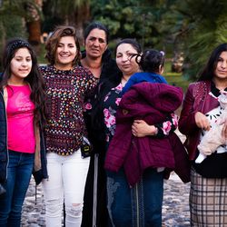 Belle Barbu, left center, stands with her mother and sisters.