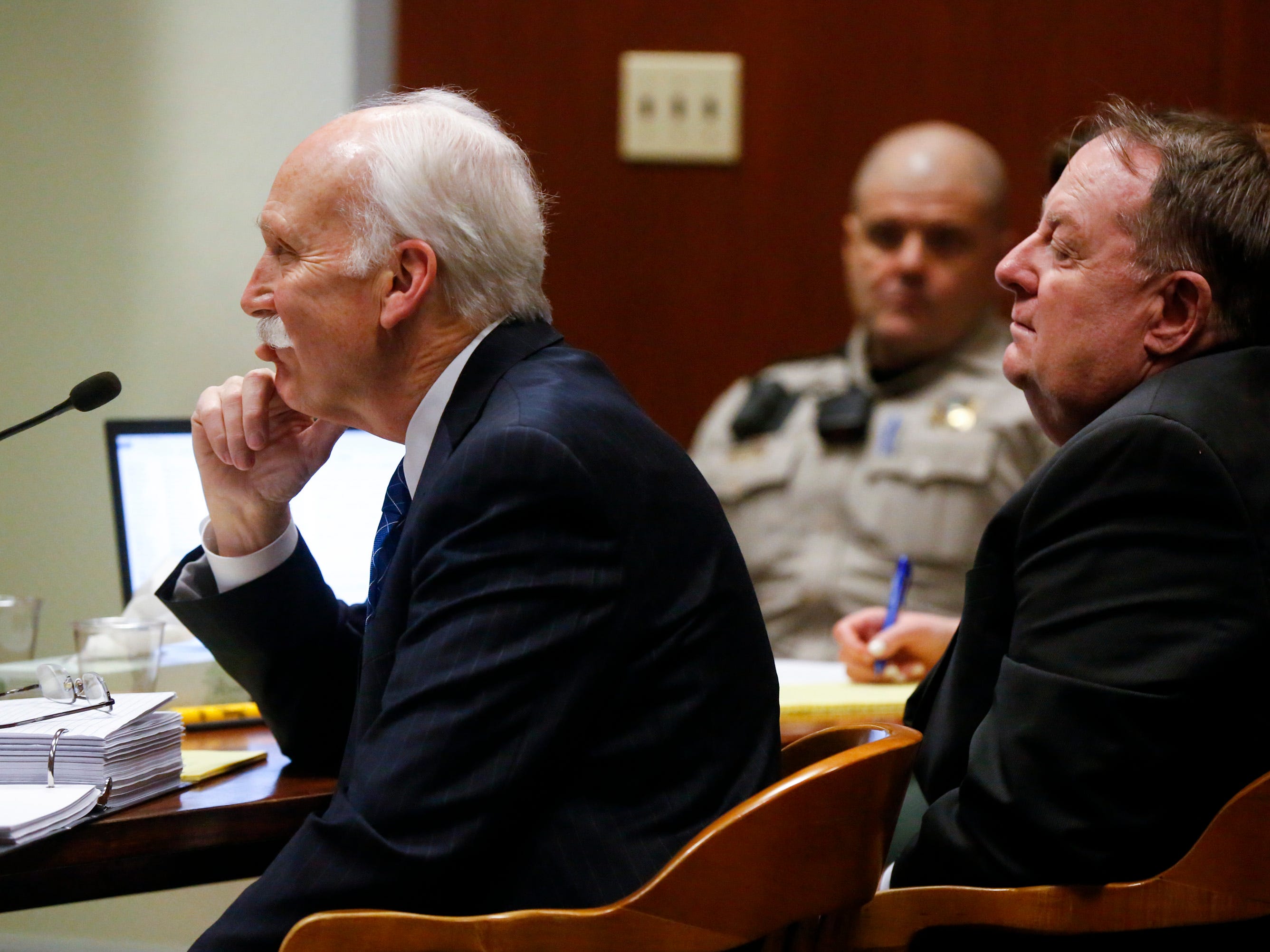 Defense attorney Leon Spies (left) questions a witness while seated alongside defendant Jerry Burns during his trial at the Scott County Courthouse in Davenport on Wednesday, Feb. 12, 2020.