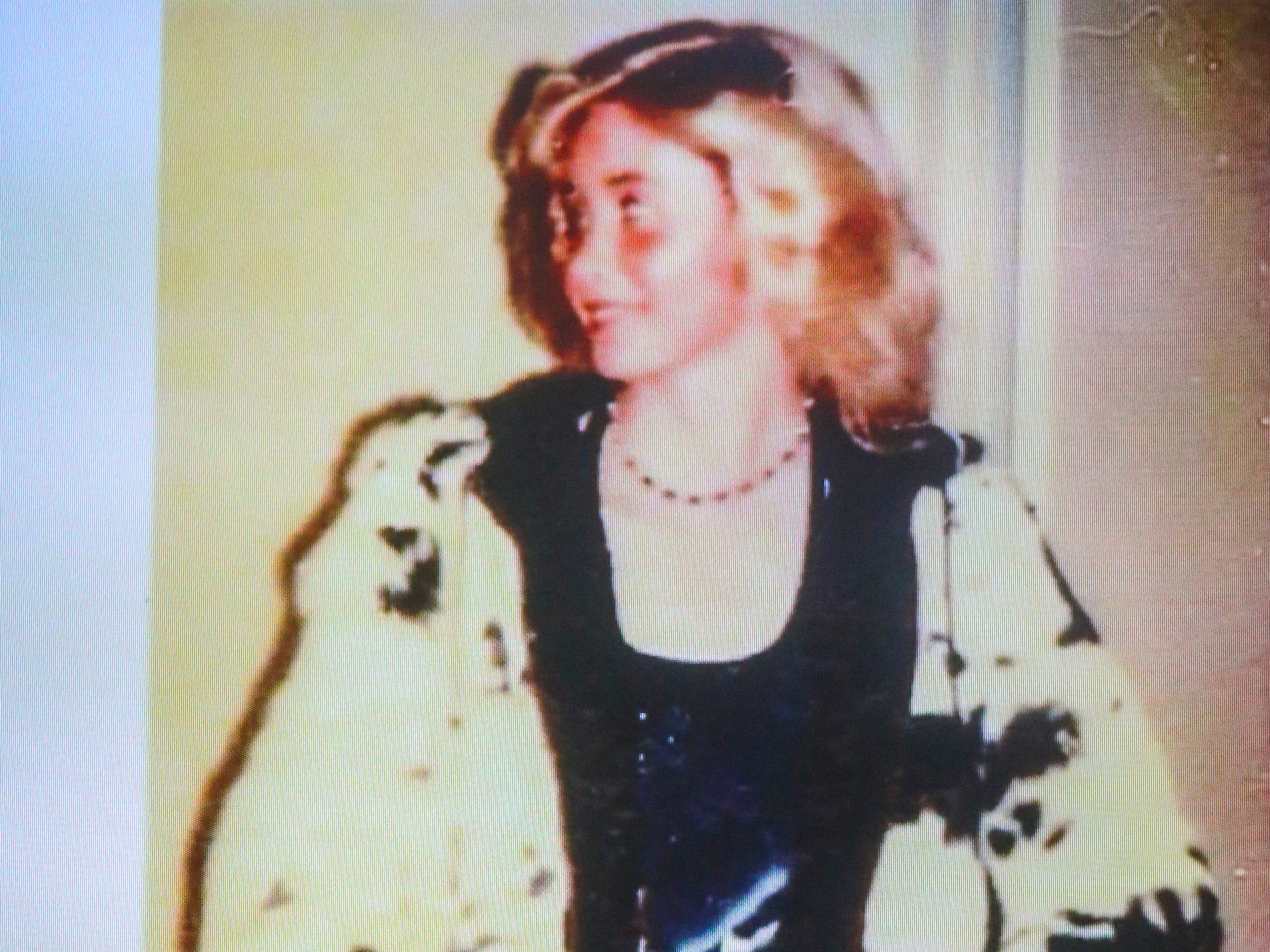 A photo of Michelle Martinko wearing the rabbit fur coat that she had on the night she was killed in 1979 is shown on a television during opening statements at the Scott County Courthouse in Davenport on Wednesday, Feb. 12, 2020.